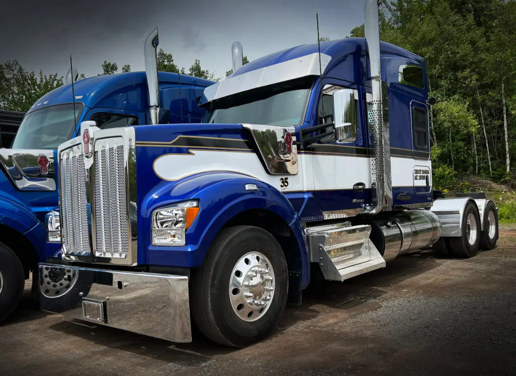 Custom striping and lettering on a Kenworth highway truck